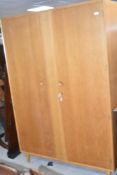 A vintage golden oak Gomme style wardrobe