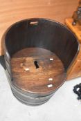 A 20th century coopered oak barrel seat, with lift-off seat and storage 65cm x 43cm
