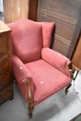 A Victorian mahogany framed easy chair having later upholstery