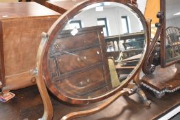 A Regency revival oval dressing table mirror of large proportions
