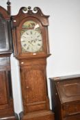 A 19th Century oak and mahogany longcase clock having eight day movement and painted dial, with