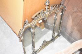 An ornate cast-brass triple wall mirror 72cm x 68cm