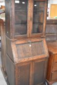 A late 19th or early 20th Century oak bureau bookcase