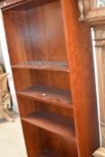A modern mahogany effect narrow bookshelf, height approx. 181cm