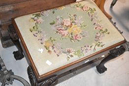 An early 20th Century mahogany dressing table stool having drop in tapestry seat, width approx.