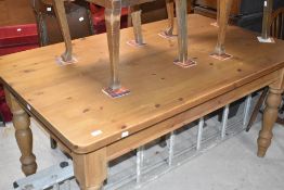 A traditional pine farmhouse kitchen table, on turned legs, approx. 152 x 91cm