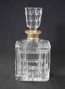 An Elizabeth II silver mounted glass decanter, of rectangular form having a flared silver rim to the