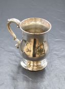A Victorian silver tankard, of traditional bulbous form, having a scroll handle and personalised