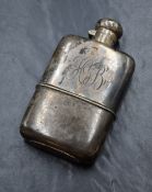 An Edwardian silver hipflask, of traditional form having 'HB' monogram engraved, marks for