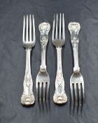 A group of four early 19th century silver King's pattern forks, all having heraldic crests to the