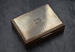 An Elizabeth II silver cigarette box, of hinged rectangular form having engine turned decoration and