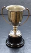 A George VI silver trophy, of traditional form having a flared rim, two decorative c-curve