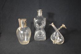 A late Victorian silver mounted glass claret jug, of traditional form having a silver hinged cover