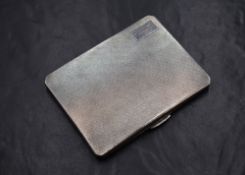 A George VI silver cigarette case, of hinged rectangular form having engine turned decoration and