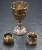 A Victorian silver cup, of traditional form having embossed hounds and trees with horse heraldic