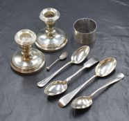 A pair of Elizabeth II silver candlesticks, of traditional stout form, having moulded sconces raised