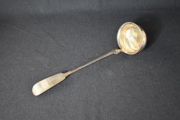 A white metal Moritz Stumpf & Sohn fiddle pattern ladle, having an engraved inscription to terminal,