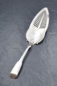 A George III silver fiddle pattern fish slice, having pierced decoration and floral engraving, marks