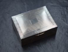 An Elizabeth II silver cigarette box, of hinged rectangular form having engine turned decoration and