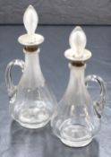 A pair of Victorian silver mounted glass decanters, of bulbous form having moulded decoration to the