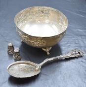 A white metal 830. grade bowl, having textured floral decoration, raised on three scroll feet, along