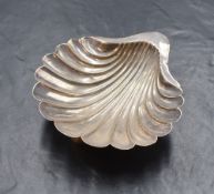 A Victorian silver shell dish, the shell motif dish raised on three ball feet, marks for