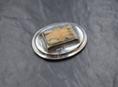 An early George V silver novelty pin cushion, having a central Union Jack flag cushion with 'One