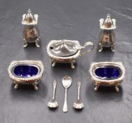 A cased Elizabeth II silver five piece condiment set, comprising two pepperettes, two salts and a