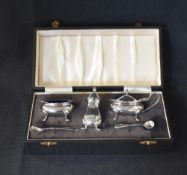A cased Elizabeth II silver condiment set, comprising salt, mustard and pepperette, of bulbous