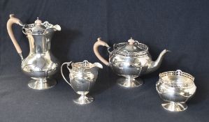 An early George V silver four piece tea set, comprising a coffee pot, teapot, sugar and cream, of