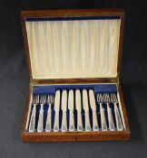 A 19th century canteen, of hinged rectangular form containing a six piece George V silver dessert