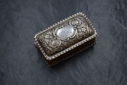 A Victorian silver trinket box, of rectangular form having a crimped rim and embossed scroll and
