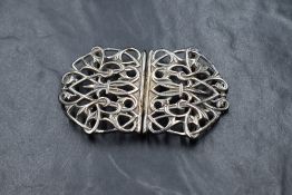 An Elizabeth II silver belt buckle, of pierced scroll form, marks for Birmingham 1972, maker