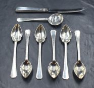 A cased Elizabeth II silver grapefruit set, comprising six spoons, a knife and a sugar sifter,