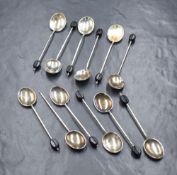 A cased set of six George V silver coffee bean spoons, of traditional form with black 'beans', marks