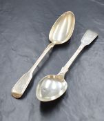 A pair of Victorian silver fiddle and thread pattern serving spoons, having heraldic crests to the