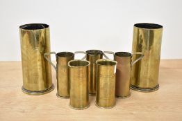 WW1 Trench Art brass shell cases, adapted mixed-size selection, three with foliate etching, two in
