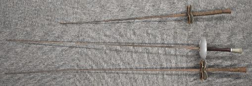 Vintage Leon Paul fencing foil, makers name PAUL visible beneath rust and tarnish, blade bent near