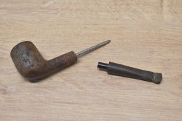 A pipe with 5cm round spike, 13cm overall, the pipe has been smoked. Of the type used by agents