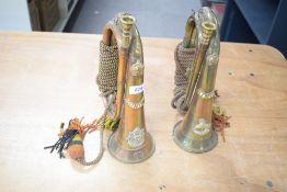 WW1 period military brass and copper bugles with badges for the Border Regiment and the King's (