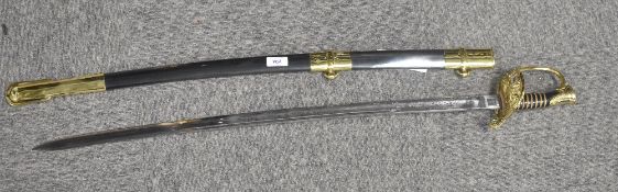 United States sabre having 75cm curved single-edged fullered blade ornately etched with foliage,