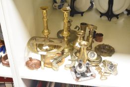 A quantity of brass ware, to include a pair of brass candlesticks, tea caddy spoon and belt buckle