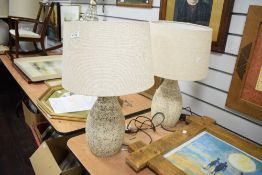 A pair of contemporary stone effect table lamps having geometrical patterns and shade, h53cm, (2)