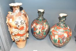 A pair of early 20th century Japanese Kutani vases, h34cm, sold together with a Satsuma vase, (3)