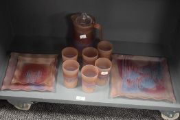 A frosted glass pitcher decorated in purple and blue iridescent patterns, h21cm, sold together