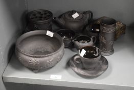 A Wedgwood black basalt spill vase, h13cm, sold together with cup, saucer, bowl ect