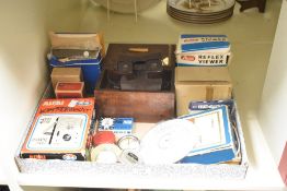 A vintage view-master reel, sold together with a Monny Estrnetes tape, a Dixons prinz flash and an