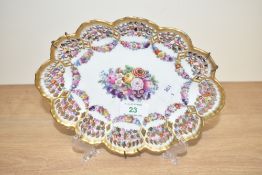 A Meissen ceramic dish having scalloped shape edges and hand painted floral patterns, cross sward