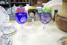 A set of 8 multi-coloured crystal cut wine glasses, h19.5cm