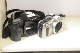 Two Canon film cameras, a Canon EOS 1000f 35mm camera and a Canon EOS IX Advanced Photo System